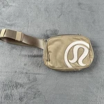 Lululemon Belt Bag Womens One Size Beige Large Logo Nylon Waist Pack Crossbody. Fixed Price $37.99.